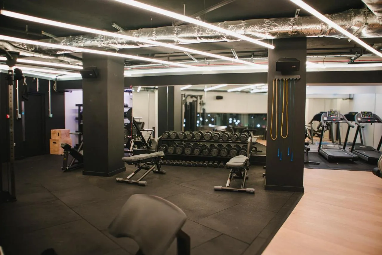 a gym with chairs and machines in the background at Zedwell Hotel Piccadilly Circus in London