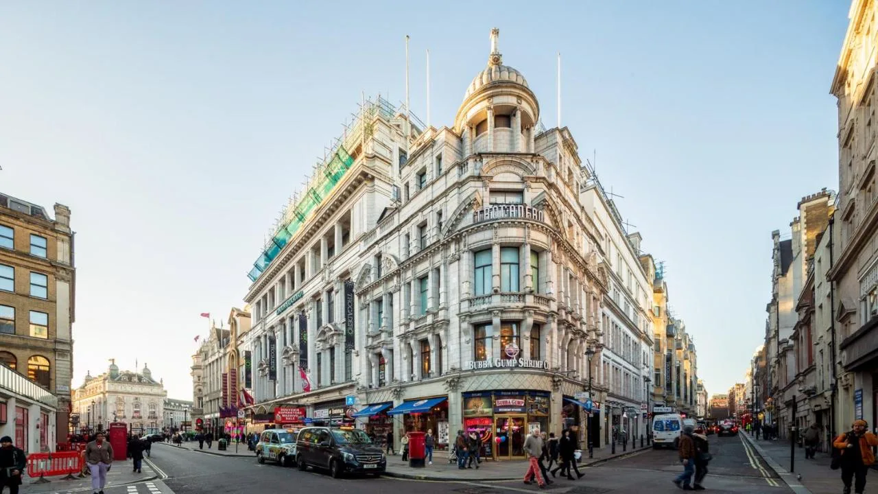 a large building on a busy city street at Zedwell Hotel Piccadilly Circus in London
